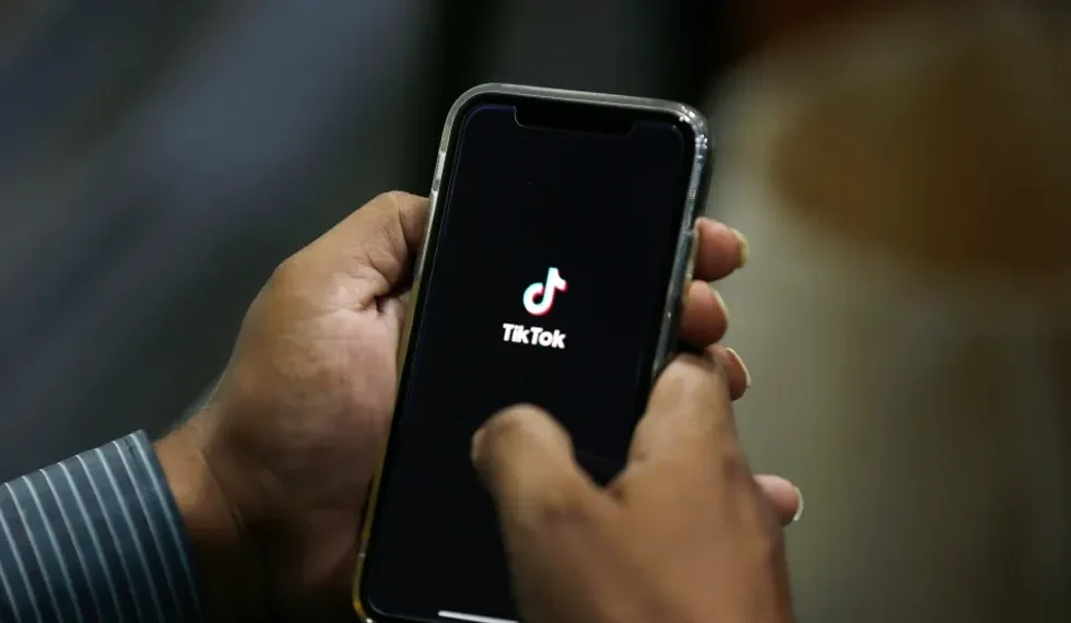TikTok logo displayed on smartphone as U.S. ownership restructuring deal announced - AP Photo/Anjum Naveed, File