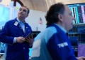 Wall Street traders react as oil prices fall during geopolitical tensions - AP Photo/Seth Wenig