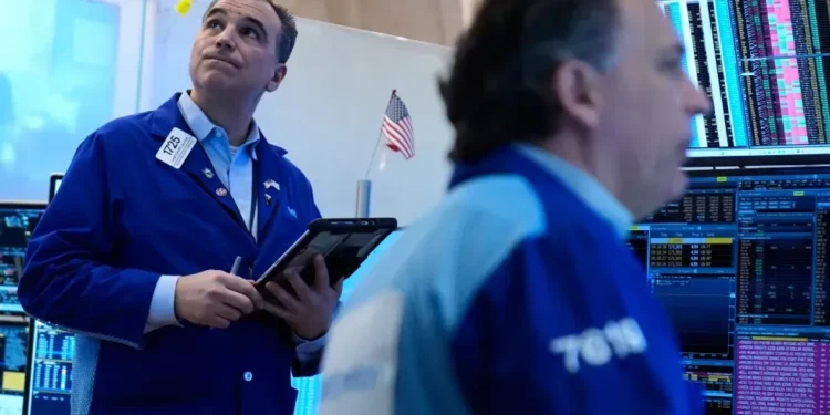 Wall Street traders react as oil prices fall during geopolitical tensions - AP Photo/Seth Wenig