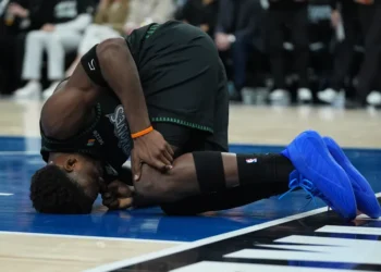 Anthony Edwards reacts after sustaining left knee injury during NBA playoff game - AP Photo/Abbie Parr