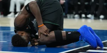 Anthony Edwards reacts after sustaining left knee injury during NBA playoff game - AP Photo/Abbie Parr
