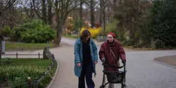 Accessible guided tour with participants using mobility aids in museum - AP Photo/Markus Schreiber