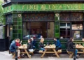 Traditional British pub crowd following unspoken bar etiquette rules - P. Batchelder/Alamy/BBC