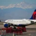 Delta aircraft as airline raises checked baggage fees - AP Photo/David Zalubowski, File