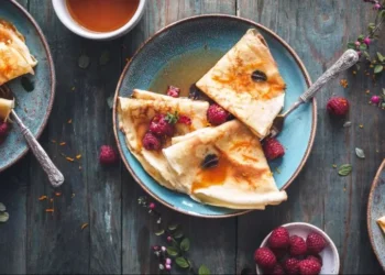 Different types of pancakes from around the world on plates - asab974/Adobe Stock via CNN