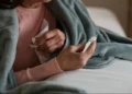 Healthcare workers manage rising influenza cases during holiday travel surge - SanyaSM/E+/Getty Images