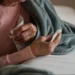 Healthcare workers manage rising influenza cases during holiday travel surge - SanyaSM/E+/Getty Images