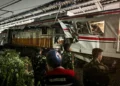 Damaged commuter trains after collision near Jakarta rail line - AP Photo/Fadian Syam