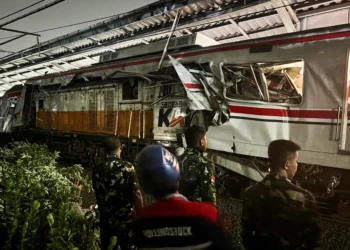 Damaged commuter trains after collision near Jakarta rail line - AP Photo/Fadian Syam