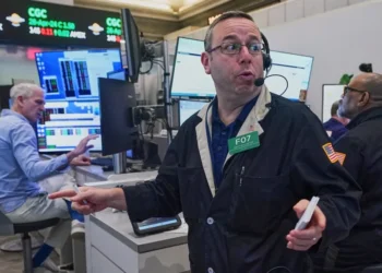 Intel logo displayed as stock markets reach record highs - AP Photo/Richard Drew