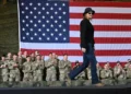 Kid Rock salutes as Army helicopters hover near Tennessee home - AP Photo/John Amis, File
