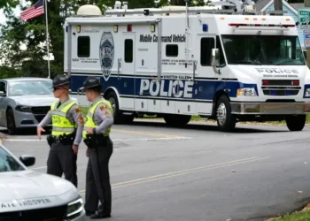 Police vehicles respond to park shooting in Winston-Salem North Carolina - AP Photo/Erik Verduzco