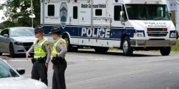 Police vehicles respond to park shooting in Winston-Salem North Carolina - AP Photo/Erik Verduzco