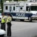 Police vehicles respond to park shooting in Winston-Salem North Carolina - AP Photo/Erik Verduzco