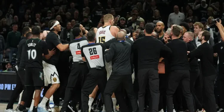 Nikola Jokic and Julius Randle during heated Nuggets Timberwolves game altercation - AP Photo/Abbie Parr