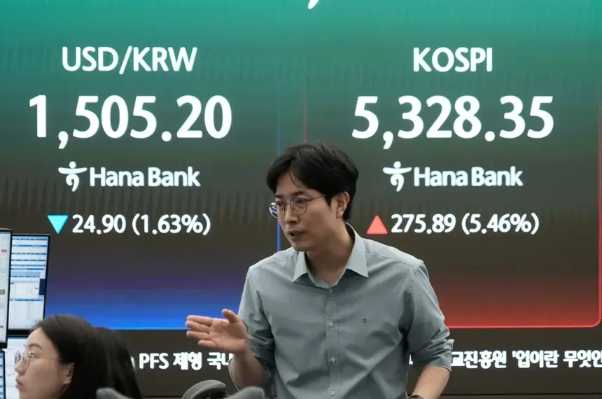 Traders monitor Asian stocks after oil falls below $100 - AP Photo/Ahn Young-joon