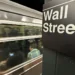 Oil pump jacks and stock market charts reflecting rising energy prices - AP Photo/Peter Morgan, File
