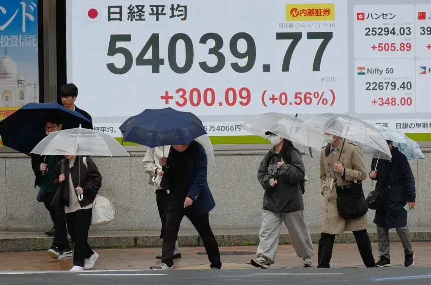 Oil traders monitor screens as Wall Street reacts to Iran risks - AP Photo/Eugine Hoshiko