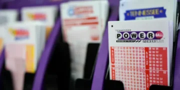 Powerball and UK National Lottery displays signal expansion launch - AP Photo/George Walker IV, File