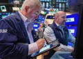 Wall Street trading floor reacting to oil price surge and tech stock decline - AP Photo/Richard Drew