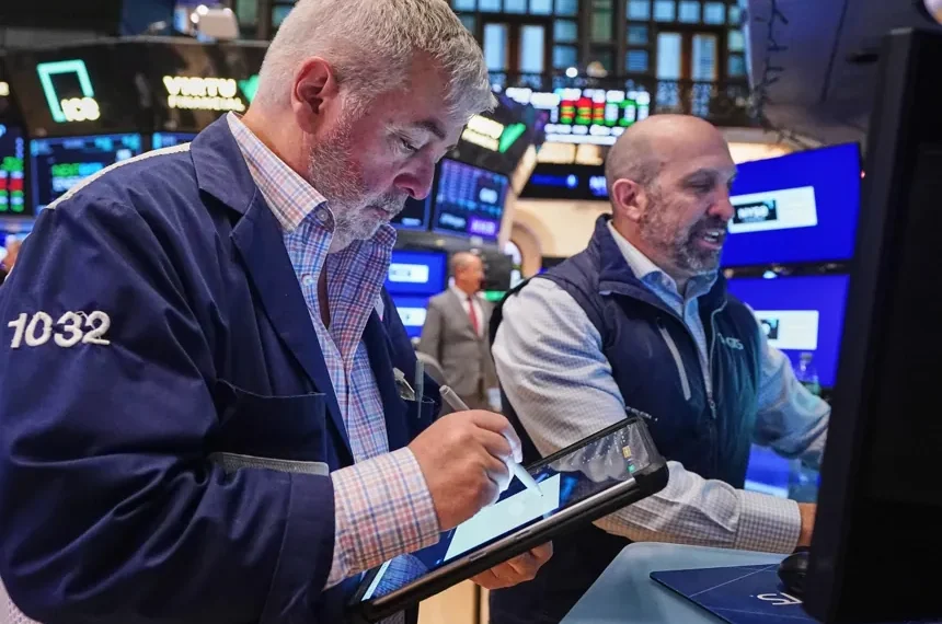 Wall Street trading floor reacting to oil price surge and tech stock decline - AP Photo/Richard Drew