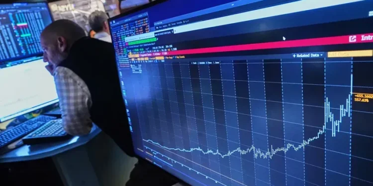 Traders monitor stock market gains despite geopolitical tensions and inflation concerns - AP Photo/Richard Drew