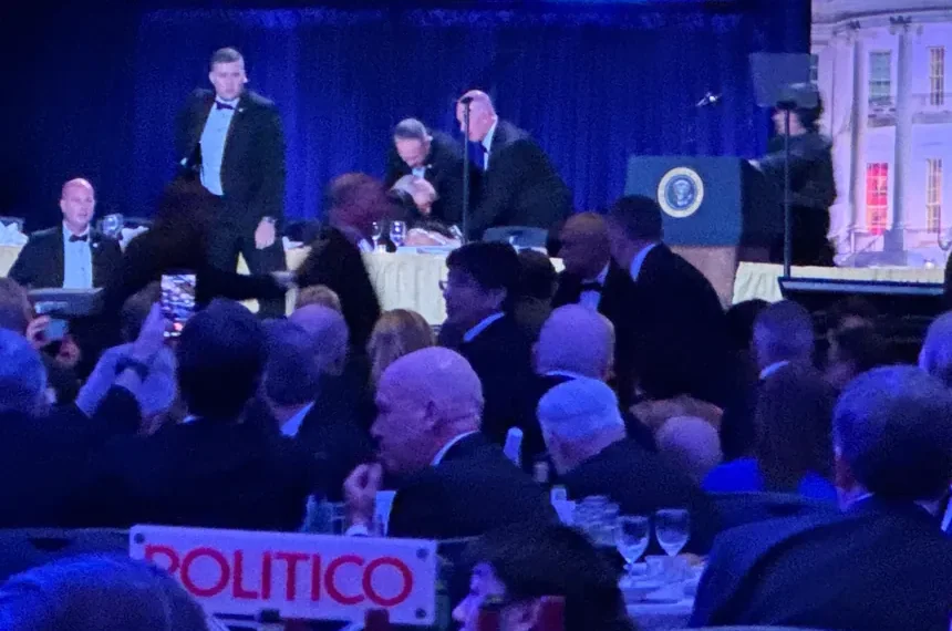 Security officers respond after gunfire near White House correspondents dinner venue - AP Photo/Mark Schiefelbein
