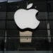Apple logo with rising financial charts representing strong iPhone sales growth - AP Photo/Matthias Schrader, File