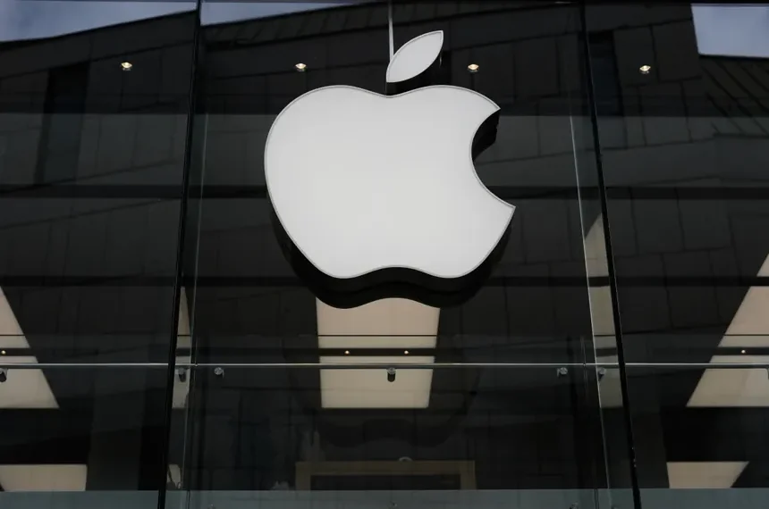 Apple logo with rising financial charts representing strong iPhone sales growth - AP Photo/Matthias Schrader, File