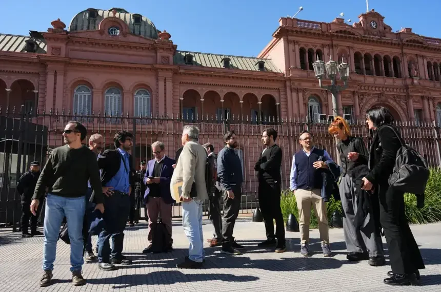 Journalists gather outside Argentina presidency after press access restored- AP Photo/Rodrigo Abd