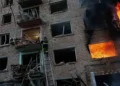 Emergency crews respond after Russian missile strikes in Kyiv amid Belarus tensions - AP Photo/Evgeniy Maloletka