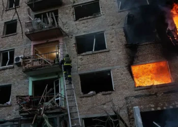 Emergency crews respond after Russian missile strikes in Kyiv amid Belarus tensions - AP Photo/Evgeniy Maloletka