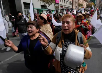 Protesters march during anti-government demonstrations in La Paz, Bolivia - AP Photo/Juan Karita