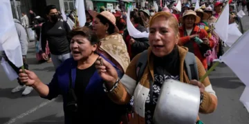 Protesters march during anti-government demonstrations in La Paz, Bolivia - AP Photo/Juan Karita