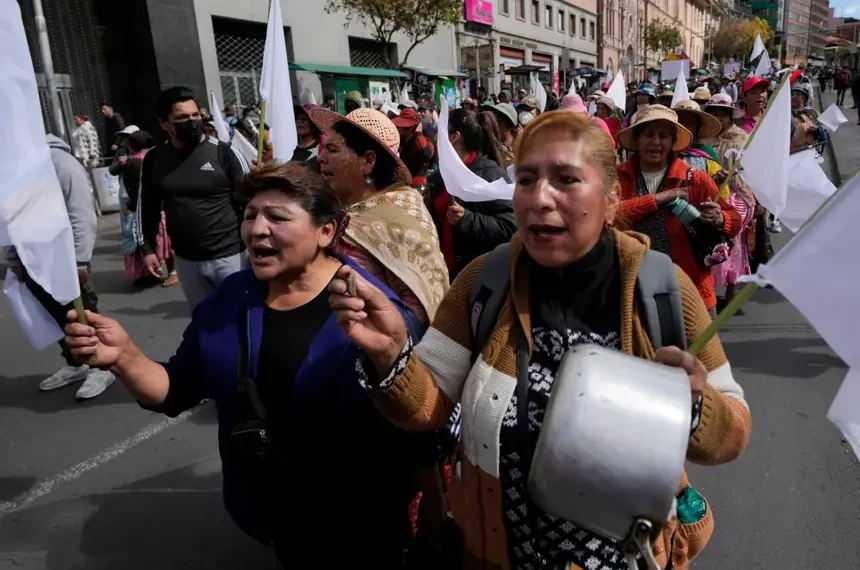 Protesters march during anti-government demonstrations in La Paz, Bolivia - AP Photo/Juan Karita