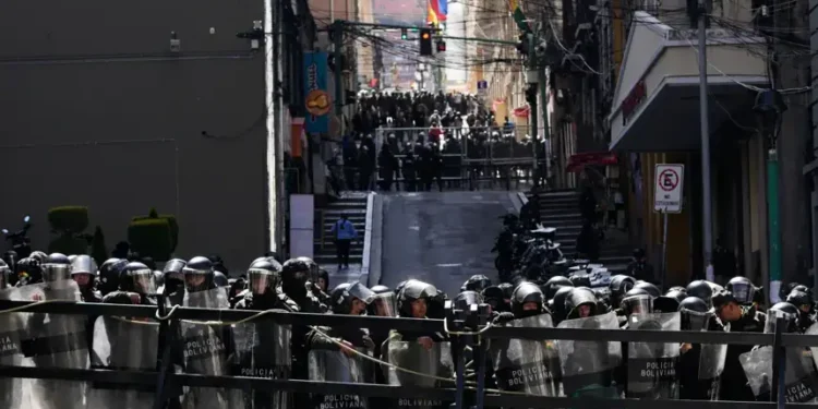 Protesters clash with police during unrest in La Paz, Bolivia - AP Photo/Juan Karita