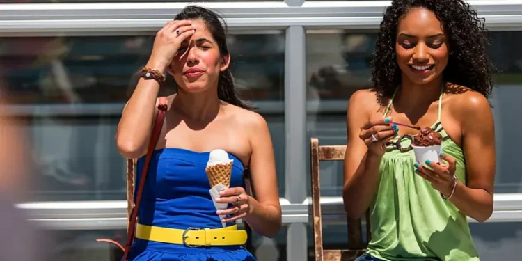 Person experiencing brain freeze after eating ice cream quickly - Credit: Getty Images