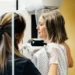 Researcher reviewing breast cancer genomic testing results in laboratory - Credit: Getty Images