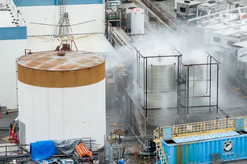 Emergency crews spray water on damaged chemical tank in California - AP Photo/Ethan Swope
