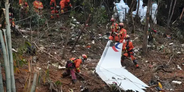 Investigators examine wreckage linked to the 2022 China Eastern plane crash - Lu Boan/Xinhua via AP, File