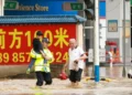 Rescue workers evacuate residents during severe flooding in China - Xiao Wei/Xinhua via AP
