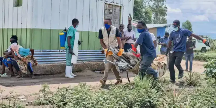Health workers in protective gear responding to Ebola outbreak in Congo - AP Photo/Dirole Lotsima Dieudonne