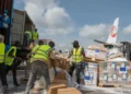 Aid workers unload emergency Ebola medical supplies in eastern Congo - AP Photo/Moses Sawasawa