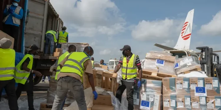 Aid workers unload emergency Ebola medical supplies in eastern Congo - AP Photo/Moses Sawasawa