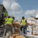 Aid workers unload emergency Ebola medical supplies in eastern Congo - AP Photo/Moses Sawasawa