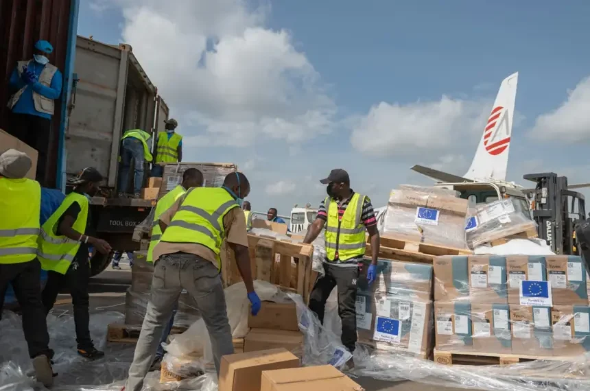 Aid workers unload emergency Ebola medical supplies in eastern Congo - AP Photo/Moses Sawasawa