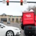 DoorDash delivery driver during rising fuel cost pressures in the U.S. - AP Photo/David Zalubowski, File