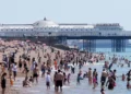 People seek shade during record-breaking heat wave in Europe - Gareth Fuller/PA via AP
