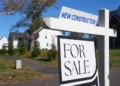 Young women reviewing housing listings amid rising U.S. home prices - AP Photo/Matt Rourke, File