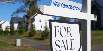 Young women reviewing housing listings amid rising U.S. home prices - AP Photo/Matt Rourke, File